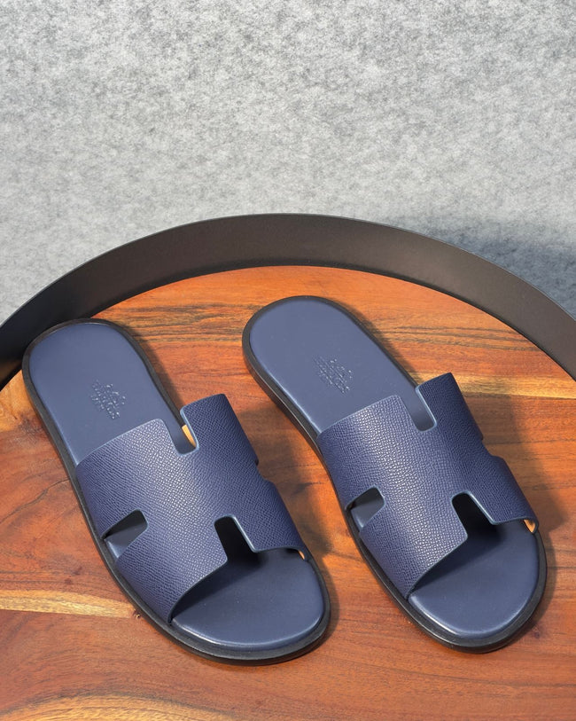 Hermès Izmir sandals in Epsom blue calfskin with the iconic H cut-out. Main Image